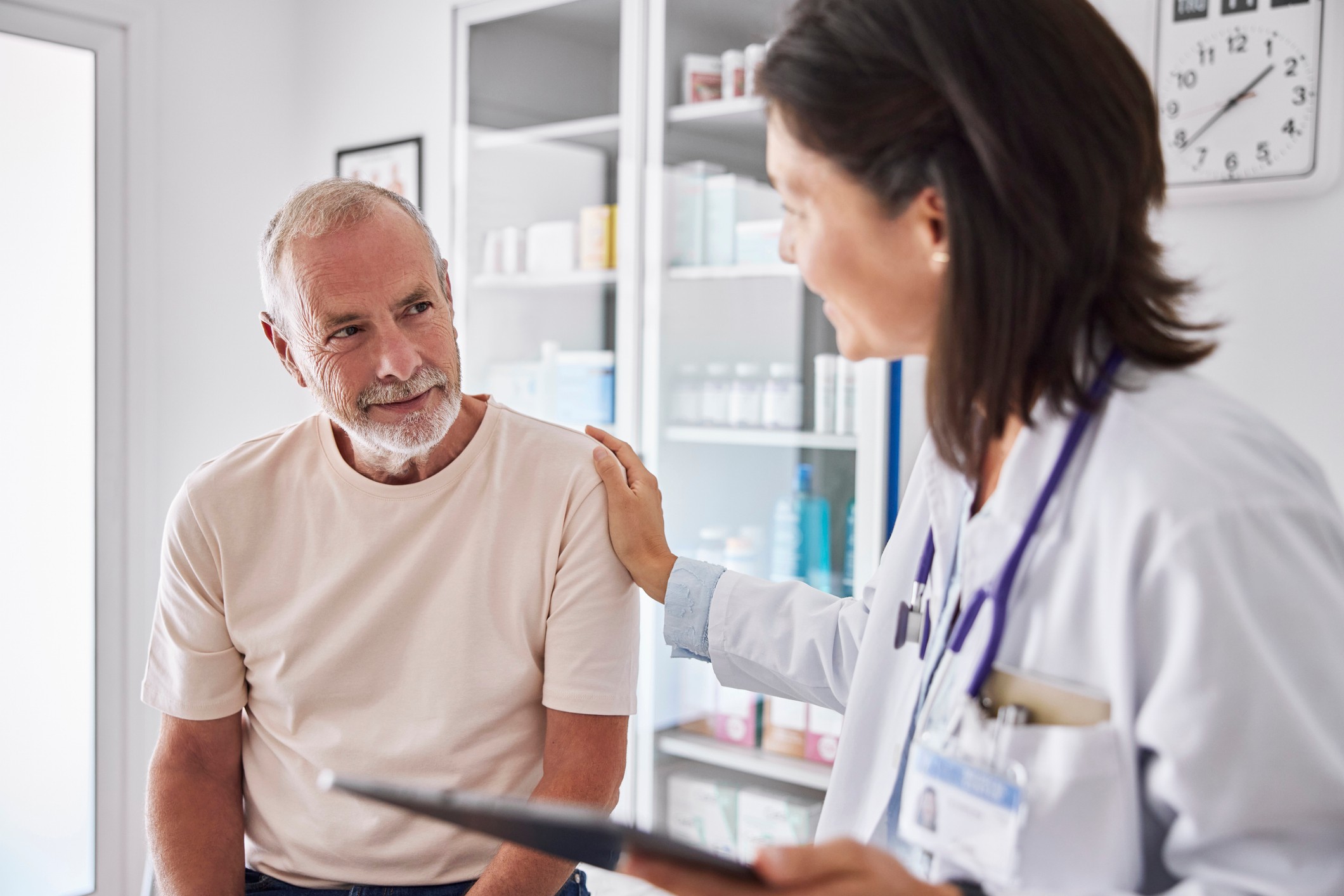 patient being talked to by caring doctor